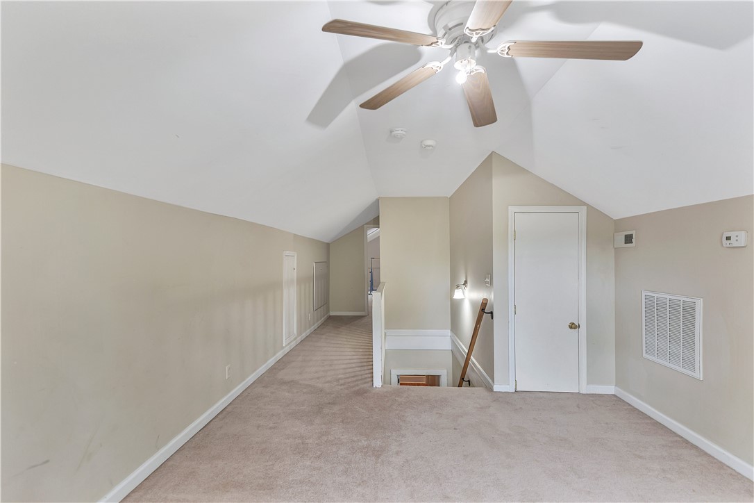 25 Central Avenue Honea Path, SC 29654 - Photo 18 of 29 Bright and airy loft space with sloped ceilings offers versatile living options.