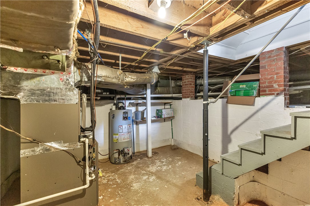25 Central Avenue Honea Path, SC 29654 - Photo 21 of 29 This functional basement provides ample storage and utility space for practical living.