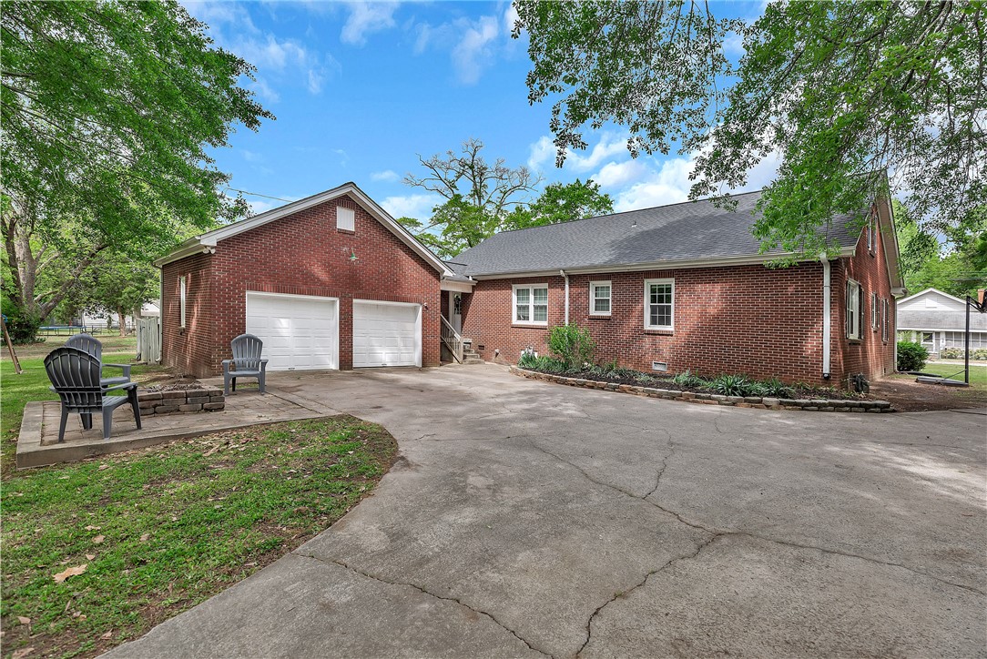 25 Central Avenue Honea Path, SC 29654 - Photo 24 of 29 This brick residence features a spacious driveway leading to the attached garage.