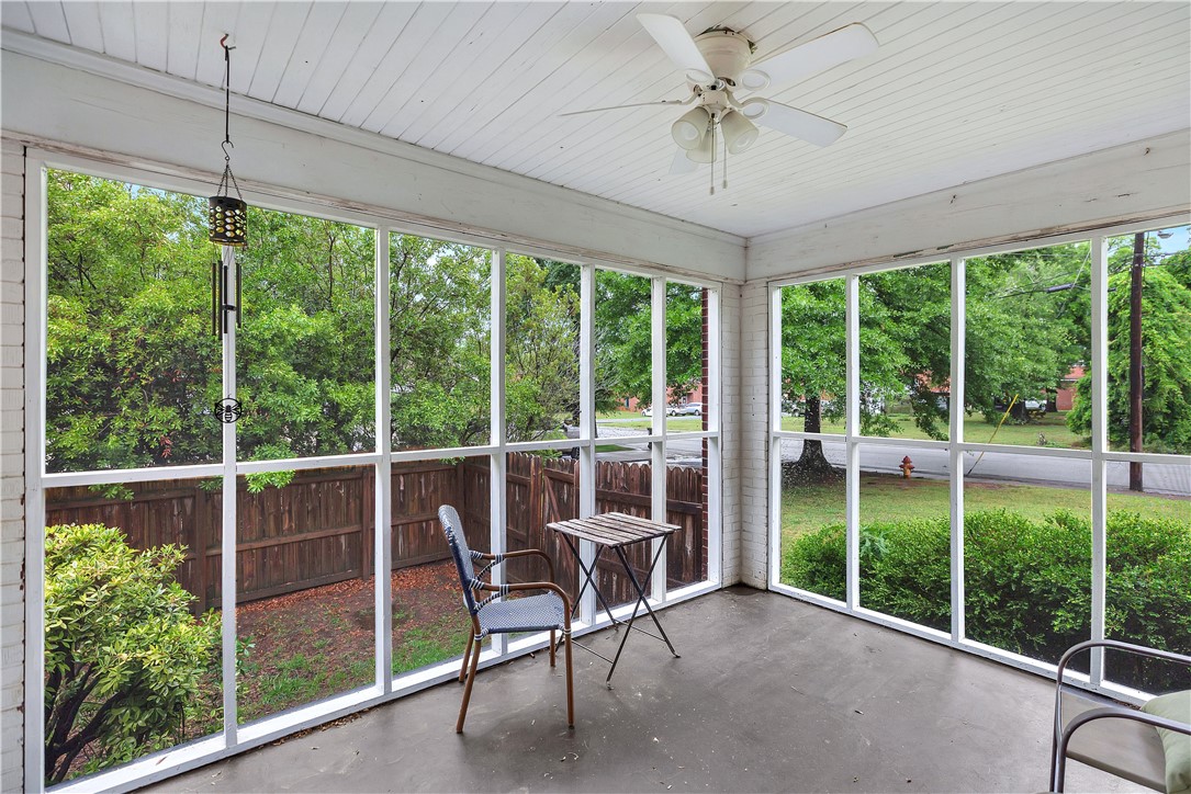 25 Central Avenue Honea Path, SC 29654 - Photo 29 of 36 This inviting screened porch offers serene views, perfect for peaceful relaxation and enjoying the outdoors.
