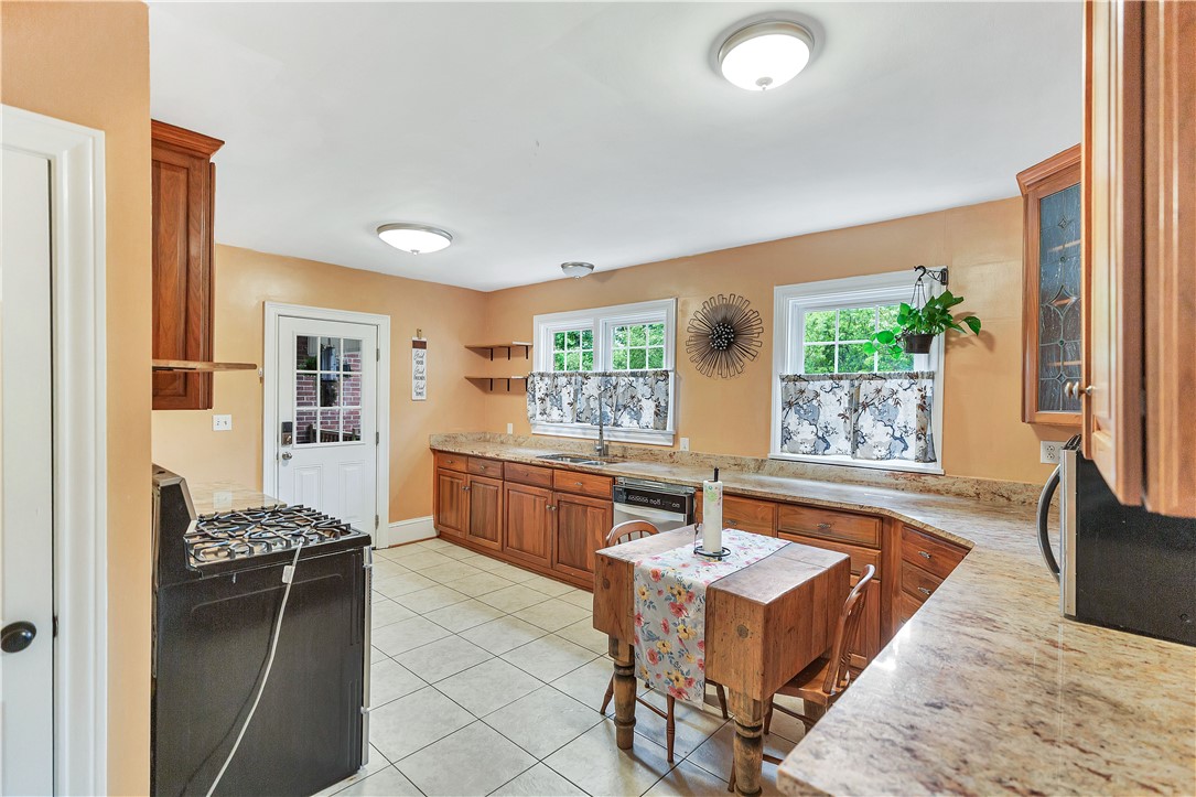 25 Central Avenue Honea Path, SC 29654 - Photo 6 of 36 This spacious kitchen offers ample cabinetry and counter space, perfect for culinary endeavors.