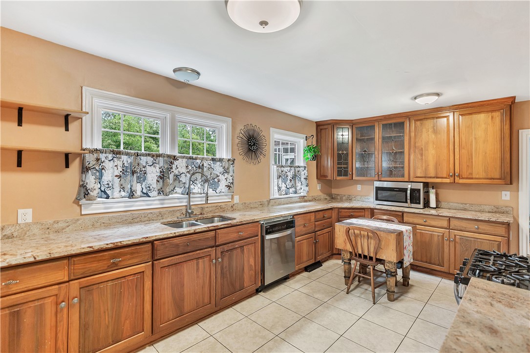 25 Central Avenue Honea Path, SC 29654 - Photo 8 of 36 This spacious kitchen offers ample cabinetry, modern appliances, and a seamless flow for everyday living.