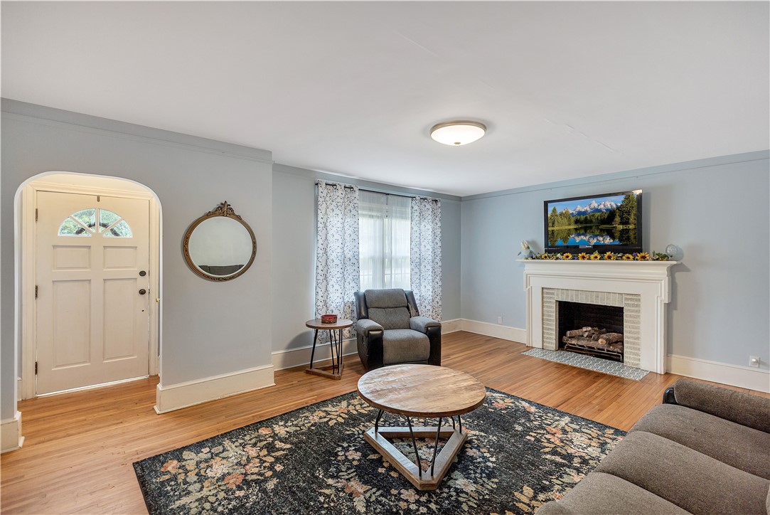 25 Central Avenue Honea Path, SC 29654 - Photo 10 of 29 This inviting living room offers warmth and comfort with natural light and classic hardwood floors.