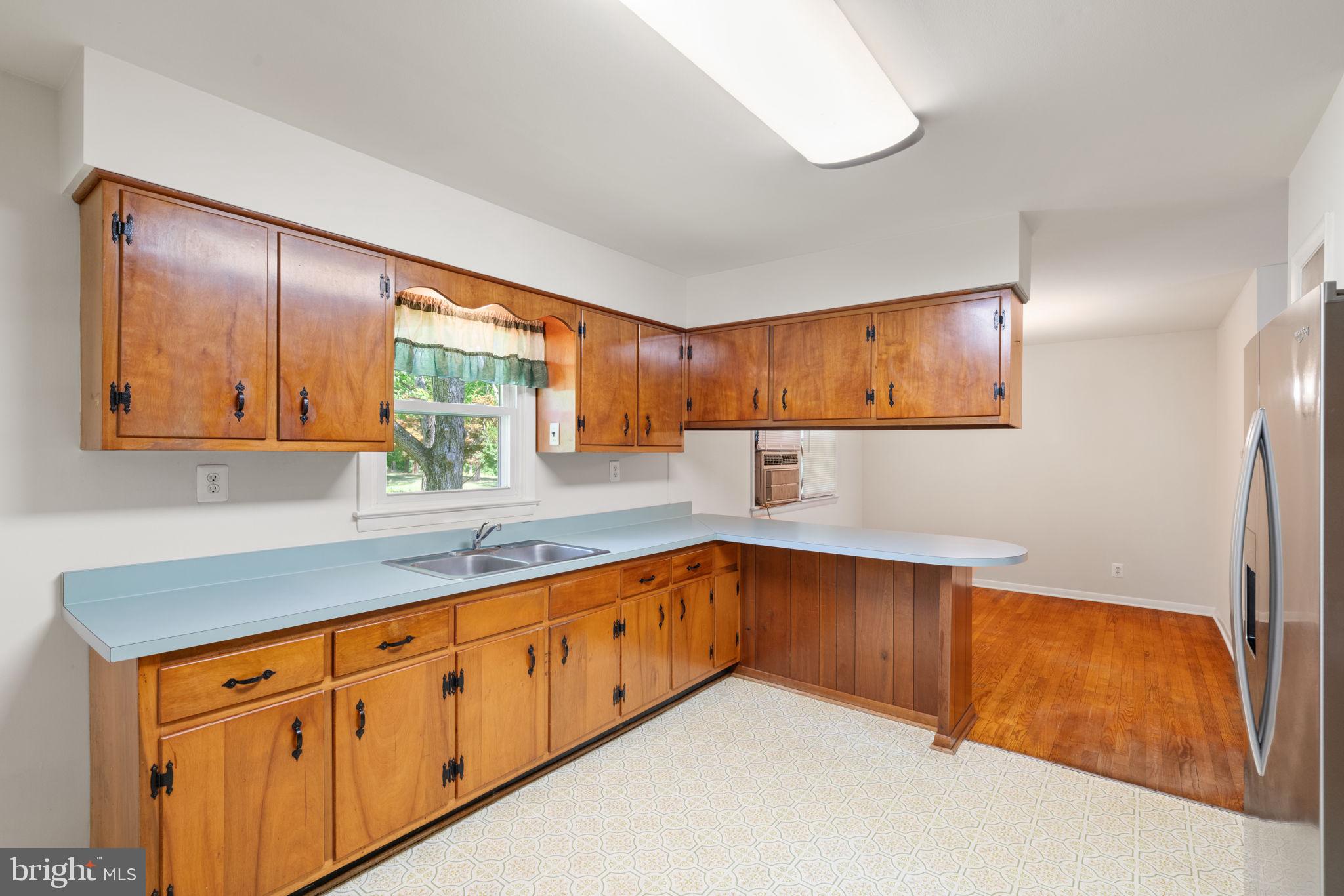 7704 Signal Hill Road Manassas, VA 20111 - Photo 10 of 46 Well maintained solid wood cabinets.