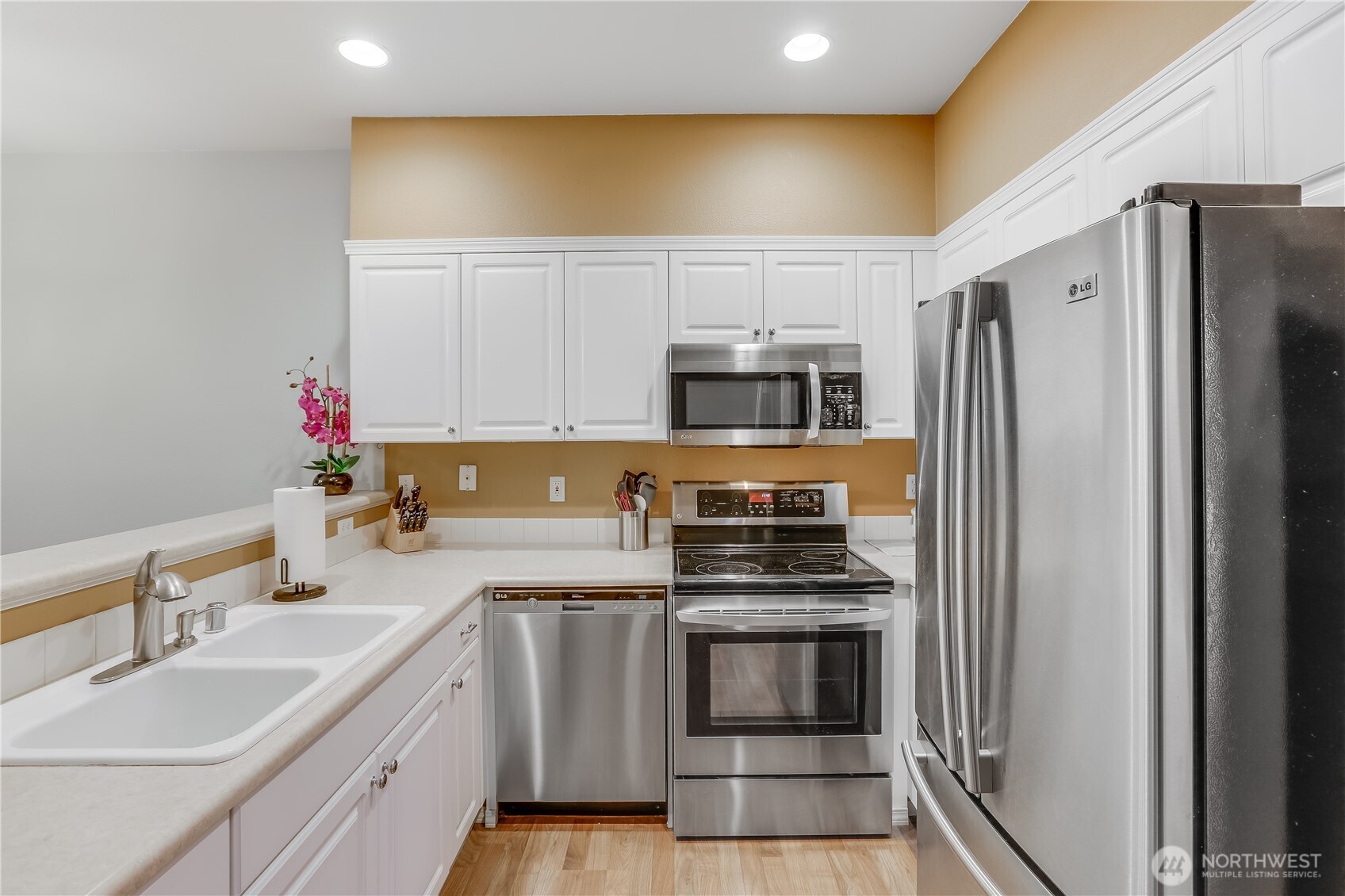 1800 Northeast 40th Street, Unit G5 Renton, WA 98056 - Photo 15 of 30 a kitchen with a sink cabinets and stainless steel appliances