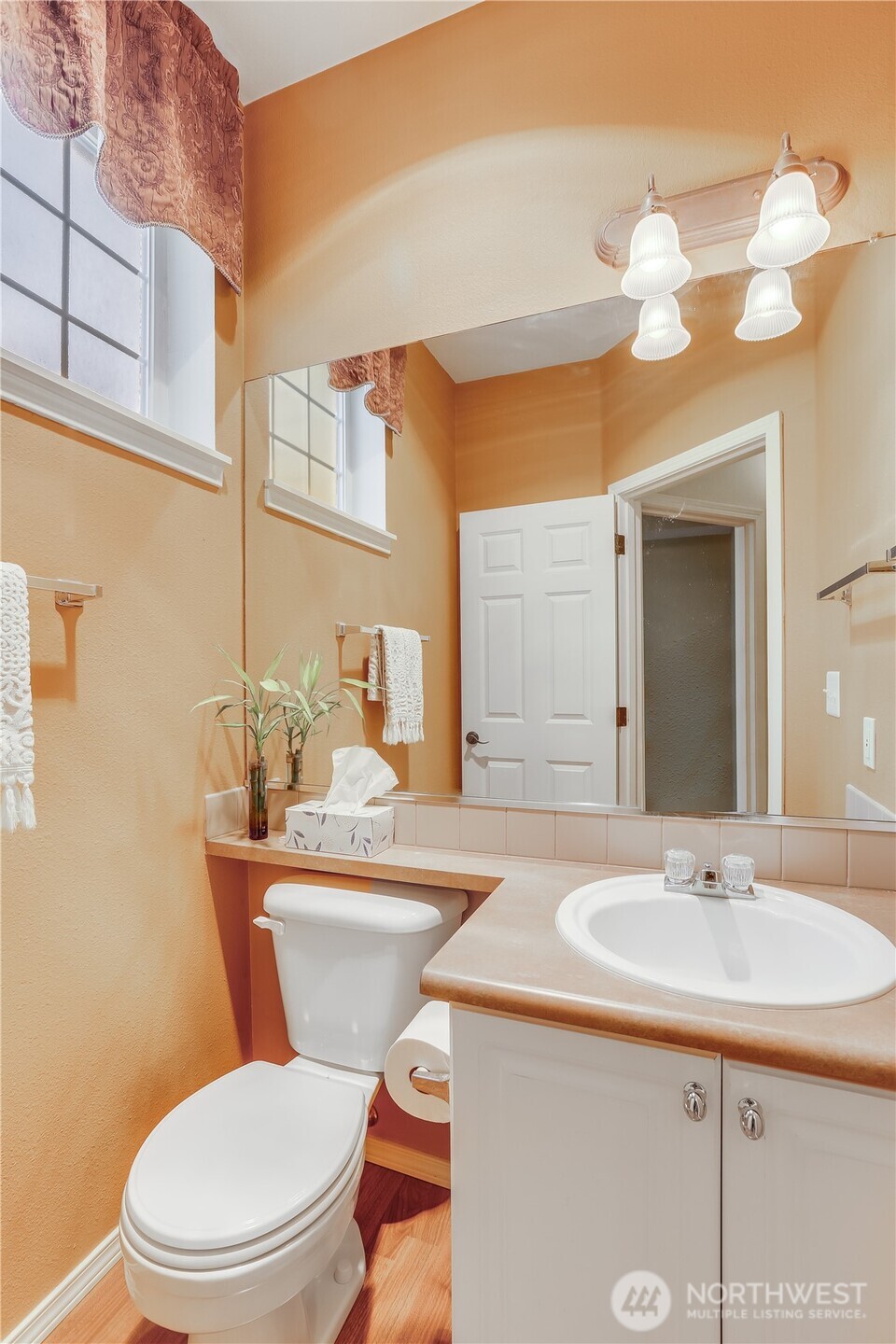 1800 Northeast 40th Street, Unit G5 Renton, WA 98056 - Photo 18 of 30 a bathroom with a sink a toilet and a mirror