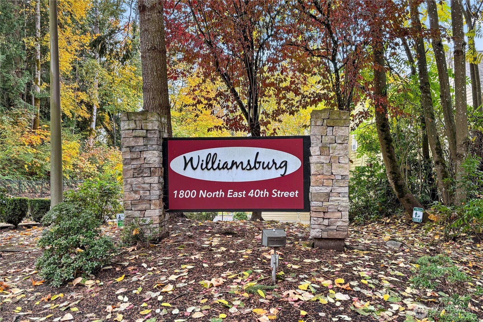 1800 Northeast 40th Street, Unit G5 Renton, WA 98056 - Photo 2 of 30 a sign that is sitting in front of a tree