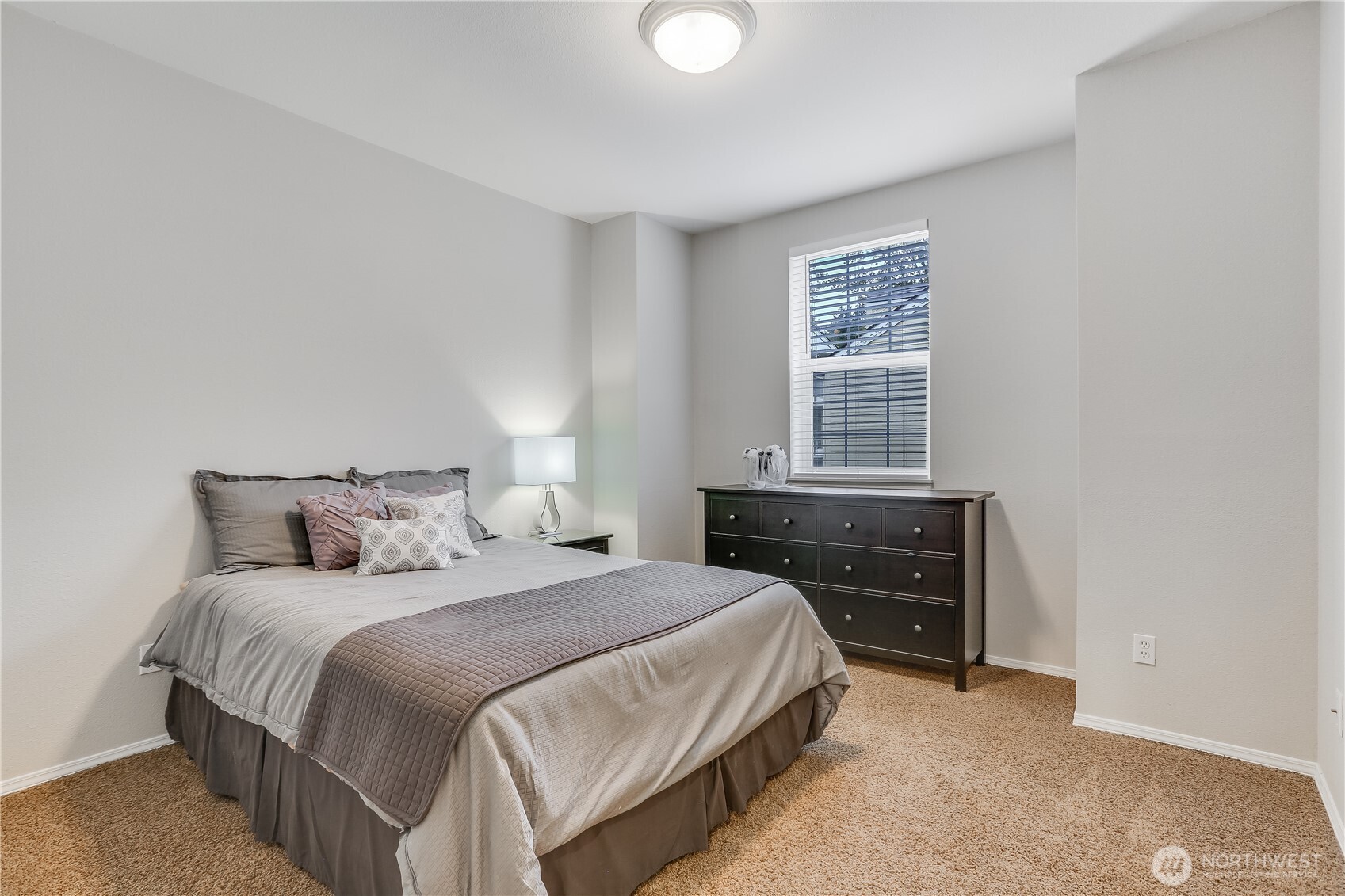 1800 Northeast 40th Street, Unit G5 Renton, WA 98056 - Photo 22 of 30 a bedroom with a bed and window