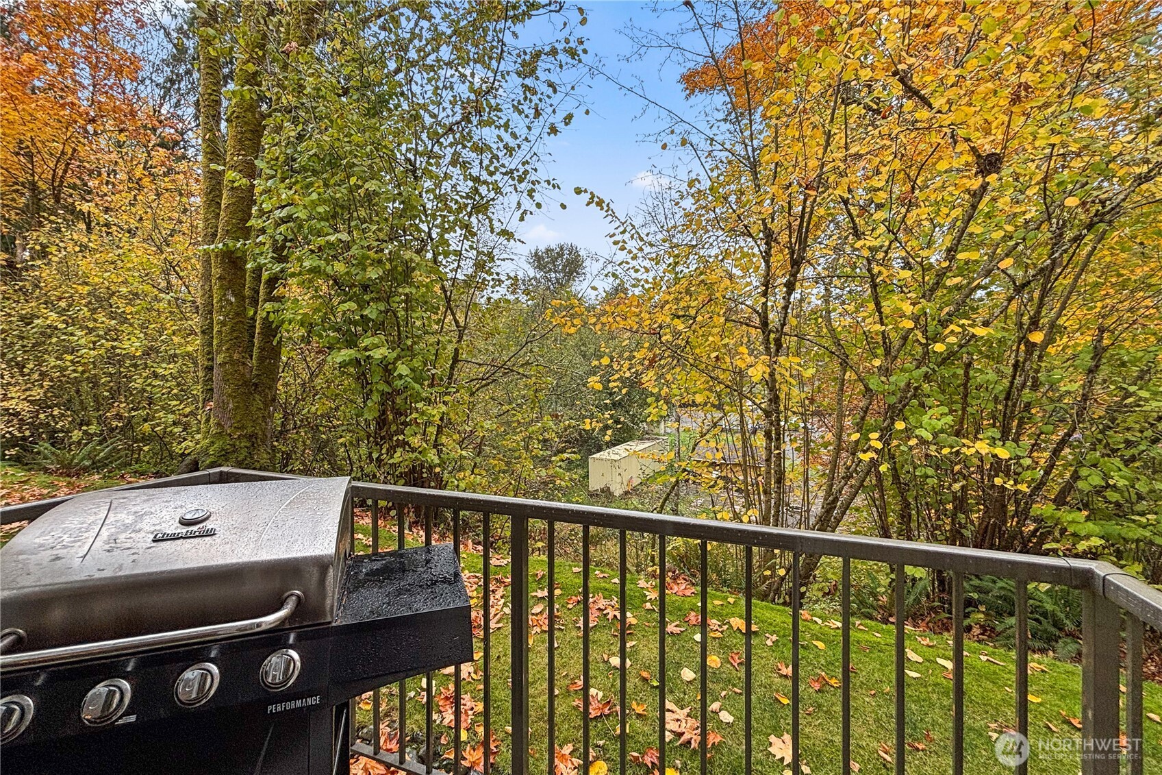 1800 Northeast 40th Street, Unit G5 Renton, WA 98056 - Photo 27 of 30 a view of a balcony with wooden floor and fence
