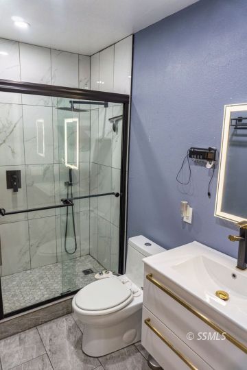 316 Mesquite Avenue Ridgecrest, CA 93555 - Photo 30 of 38 a bathroom with a toilet sink and shower
