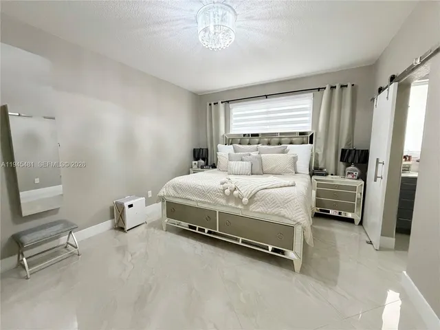 a bathroom with a double vanity sink mirror and toilet