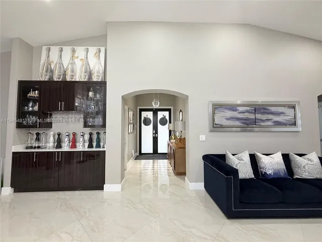 a large room with a couch and a view of living room