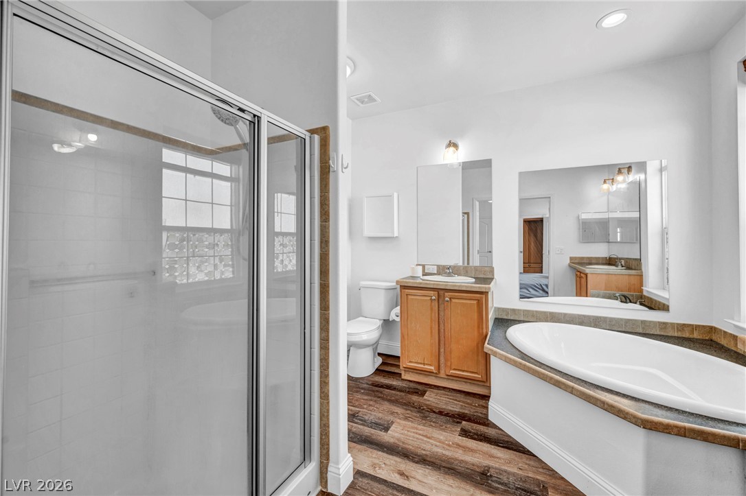 225 California Street Searchlight, NV 89046 - Photo 43 of 64 Indulge in this well-appointed bath, featuring a generous soaking tub and a separate glass-enclosed shower.