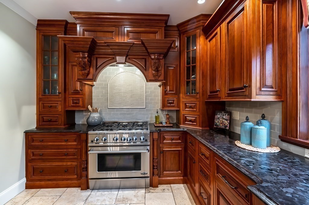 9 Prides Circle Andover, MA 01810 - Photo 16 of 42 a stove top oven sitting inside of a kitchen