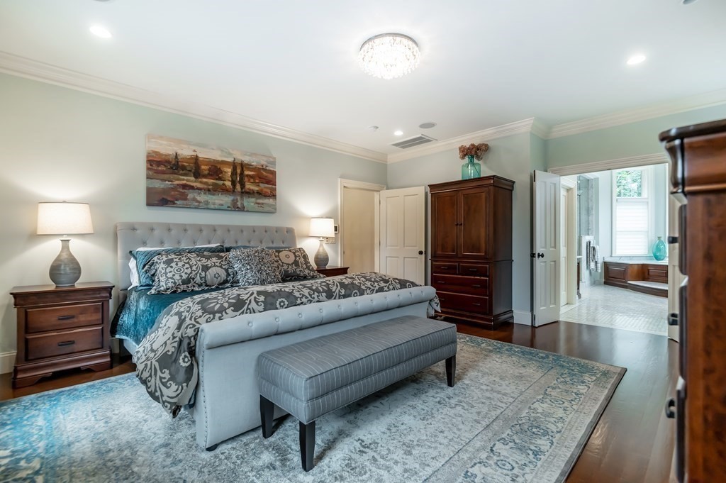 9 Prides Circle Andover, MA 01810 - Photo 22 of 42 a living room with furniture and a flat screen tv