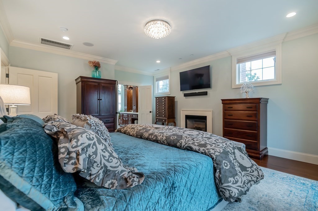 9 Prides Circle Andover, MA 01810 - Photo 23 of 42 a bedroom with a bed and a flat screen tv