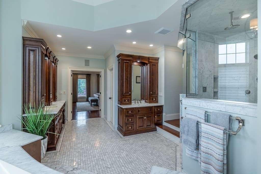 9 Prides Circle Andover, MA 01810 - Photo 26 of 42 a spacious bathroom with a double vanity sink and a large mirror