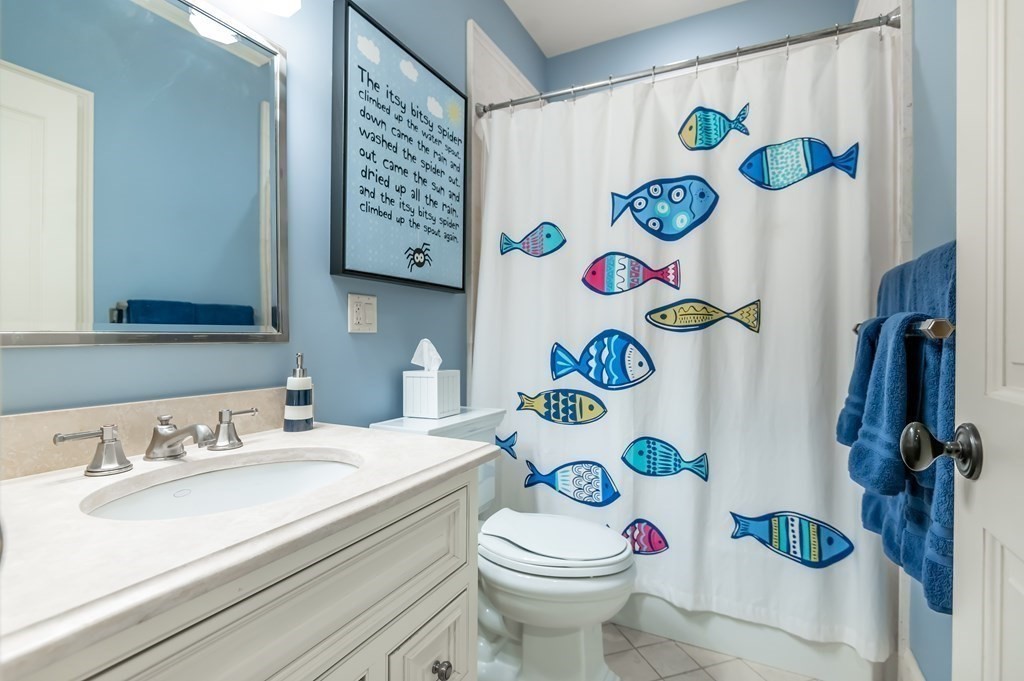 9 Prides Circle Andover, MA 01810 - Photo 30 of 42 a bathroom with a sink mirror vanity and toilet