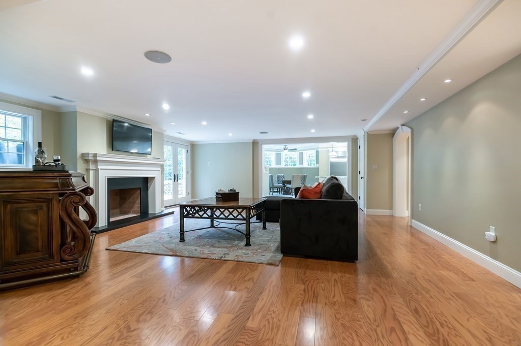 9 Prides Circle Andover, MA 01810 - Photo 35 of 42 a living room with furniture and a fireplace