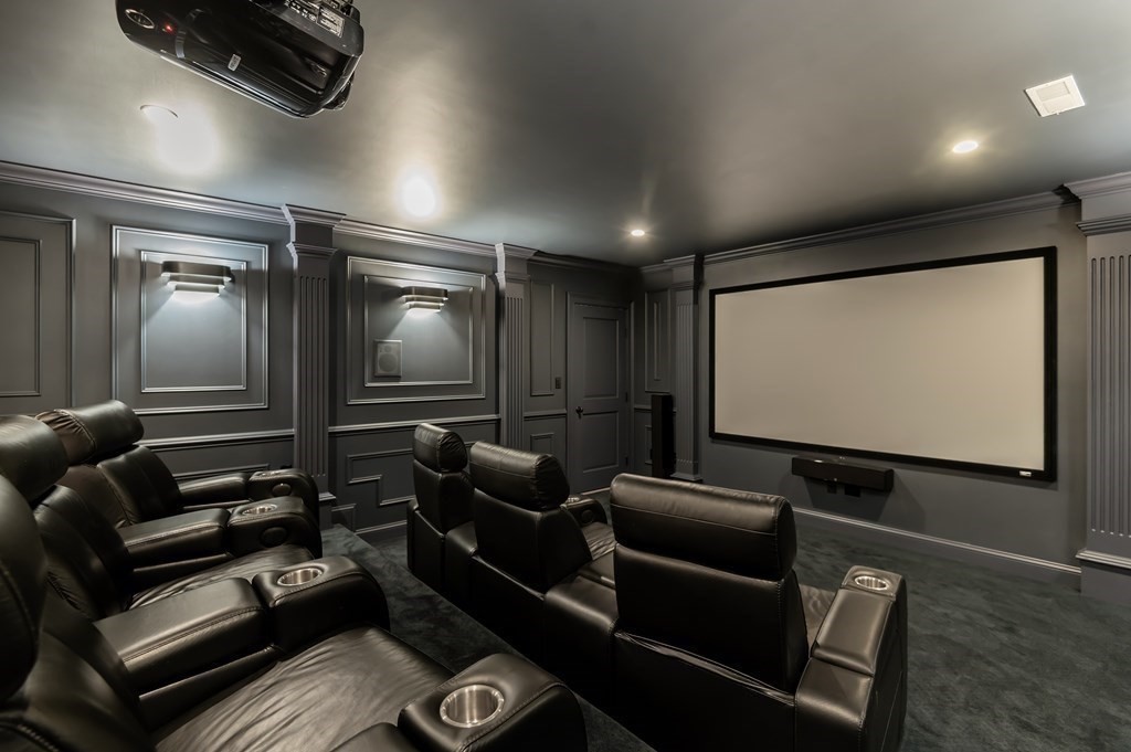 9 Prides Circle Andover, MA 01810 - Photo 36 of 42 a projector room with projector and screen