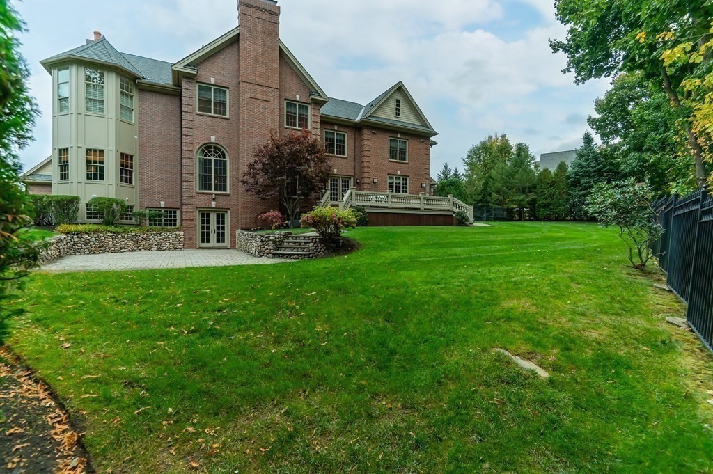 9 Prides Circle Andover, MA 01810 - Photo 38 of 42 a front view of a house with garden and porch