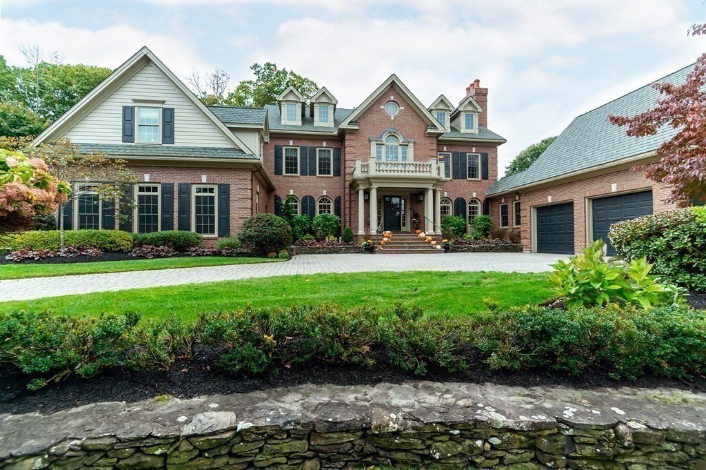 9 Prides Circle Andover, MA 01810 - Photo 40 of 42 a front view of a house with porch and garden