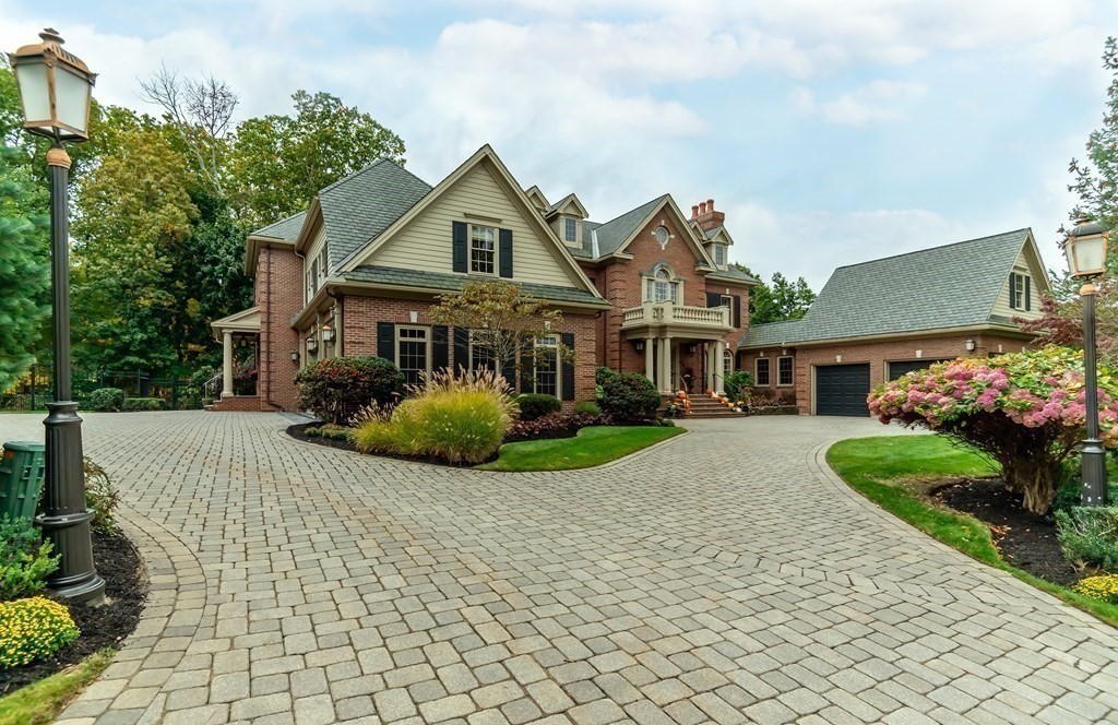 9 Prides Circle Andover, MA 01810 - Photo 41 of 42 a front view of a house with a garden and plants