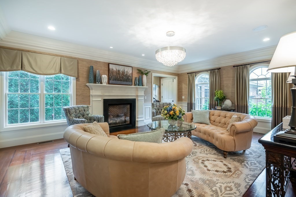 9 Prides Circle Andover, MA 01810 - Photo 7 of 42 a living room with furniture and a fireplace