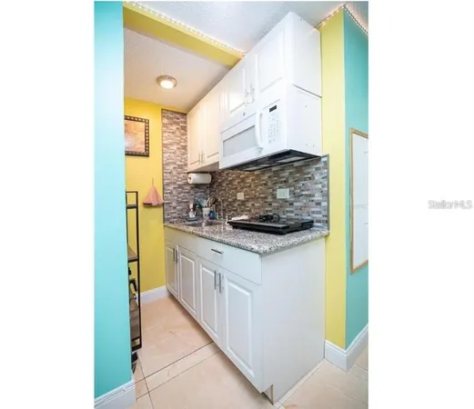 a kitchen with a sink and a stove