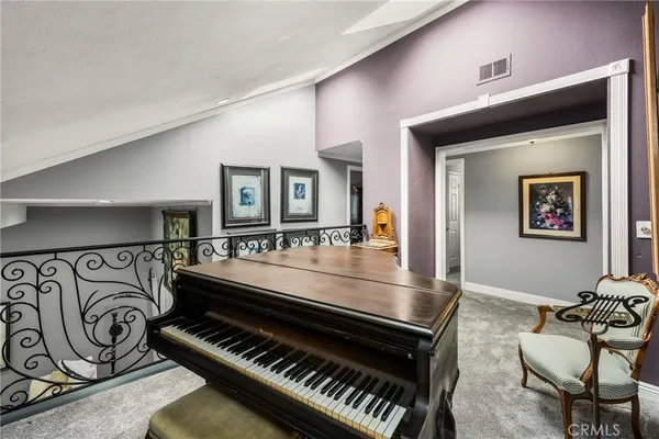a bedroom with a bed and flat screen tv
