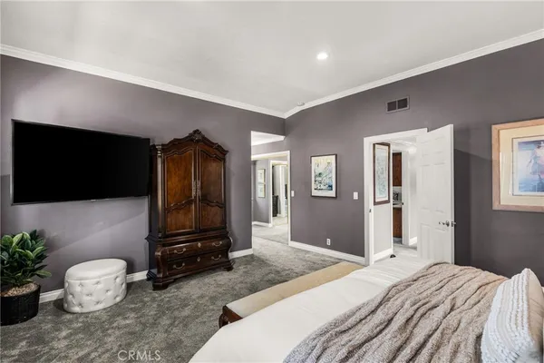 a kitchen with cabinets and chairs