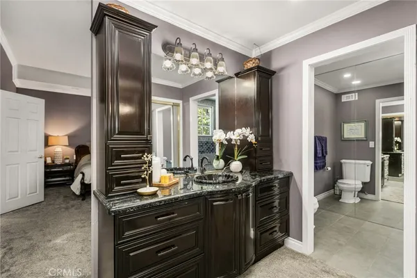 a hallway with dining table and chairs