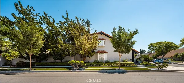 a view of a street with houses on both side