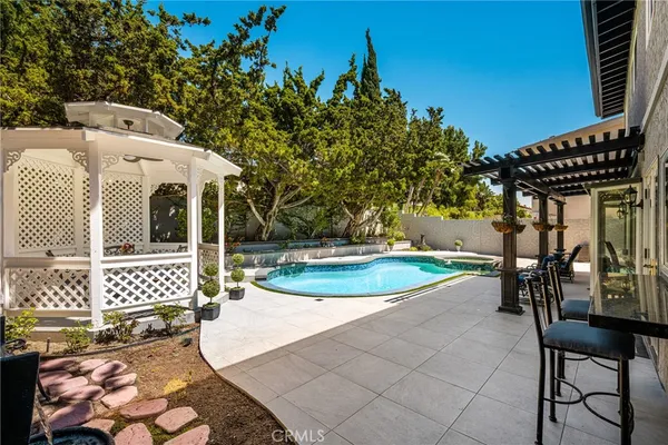 swimming pool view with a outdoor seating