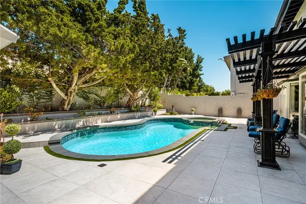 a view of swimming pool with a patio