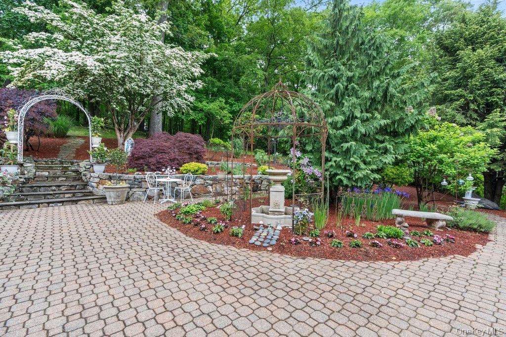 266 Shear Hill Road Mahopac, NY 10541 - Photo 21 of 34 a view of a chairs and table in the backyard
