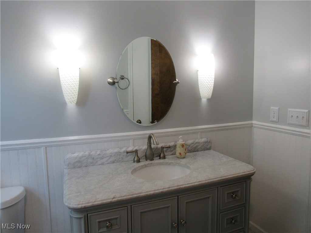 1120 Vincent Road Southeast North Canton, OH 44720 - Photo 32 of 50 Bathroom featuring toilet and vanity