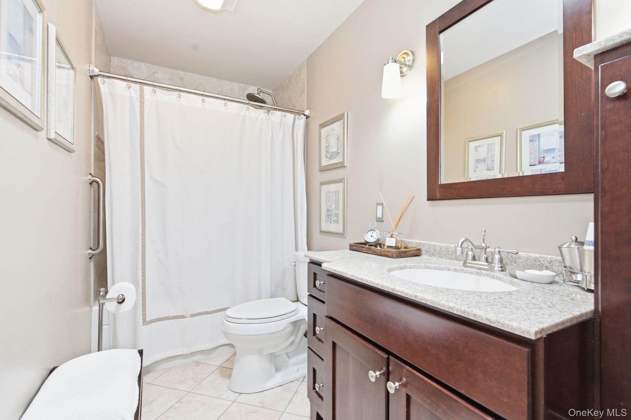 32 Bedell Road Katonah, NY 10536 - Photo 22 of 49 The renovated hall bath features a deep soaking tub, granite vanity, and radiant heated floors.