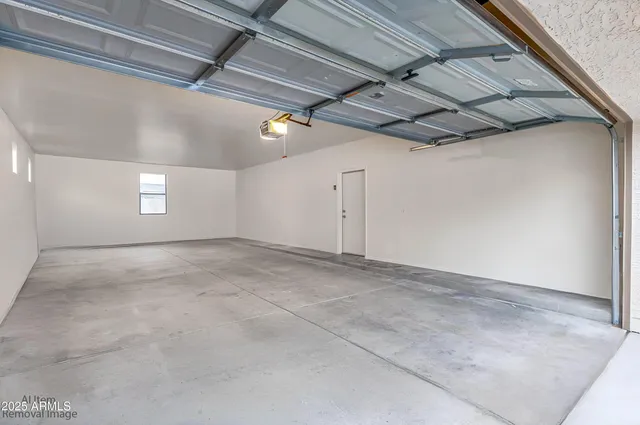 a view of livingroom with couch and window