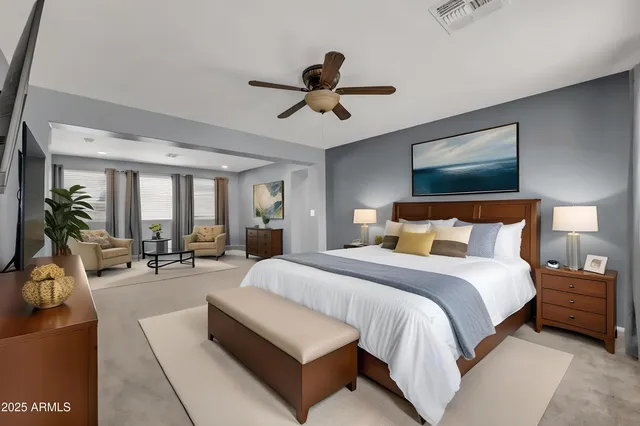 a bedroom with a bed and a book shelf