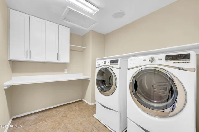 a bed room with a bed and a chair