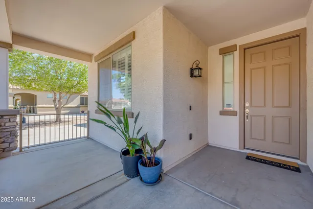 a view of a hallway with wooden floor and closet