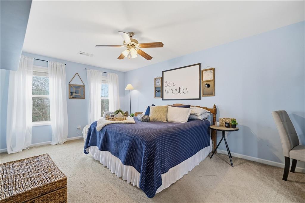 615 Myers Gate Road Ball Ground, GA 30107 - Photo 21 of 43 a bedroom with a bed chair and window
