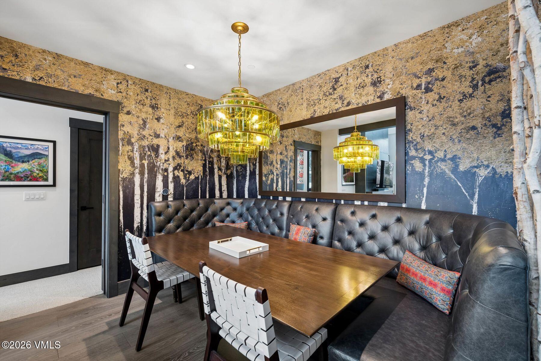 42 Riverfront Lane, Unit 508 Avon, CO 81620 - Photo 15 of 57 a dining room with furniture and a chandelier