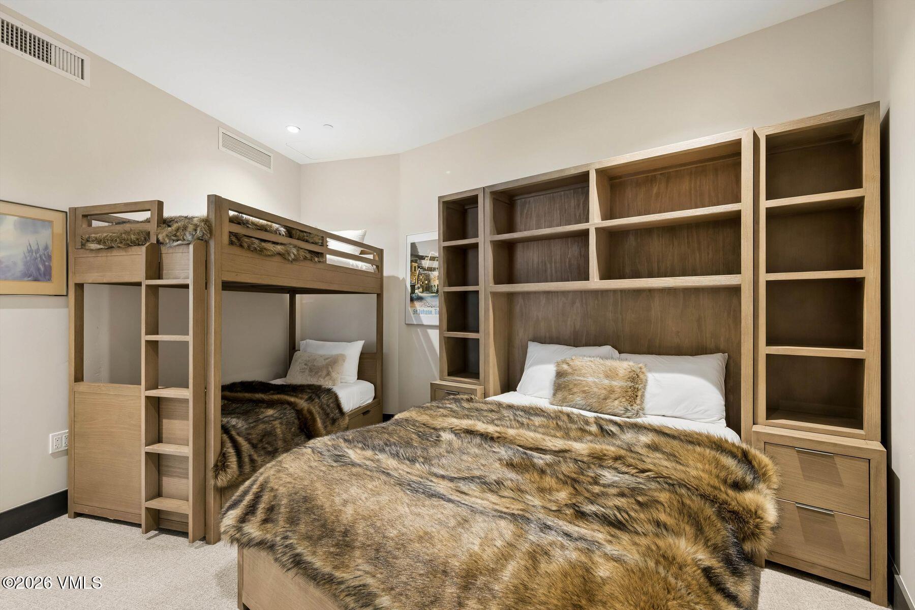 42 Riverfront Lane, Unit 508 Avon, CO 81620 - Photo 24 of 57 a bedroom with a bed and a window