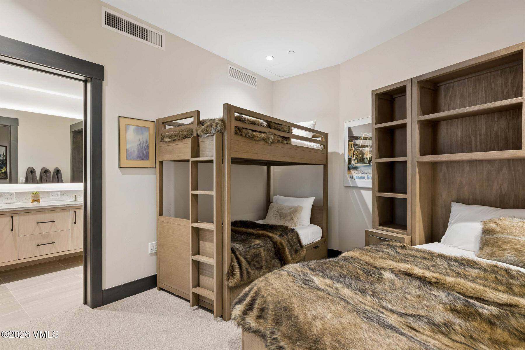 42 Riverfront Lane, Unit 508 Avon, CO 81620 - Photo 25 of 57 a bedroom with a bed and cabinet