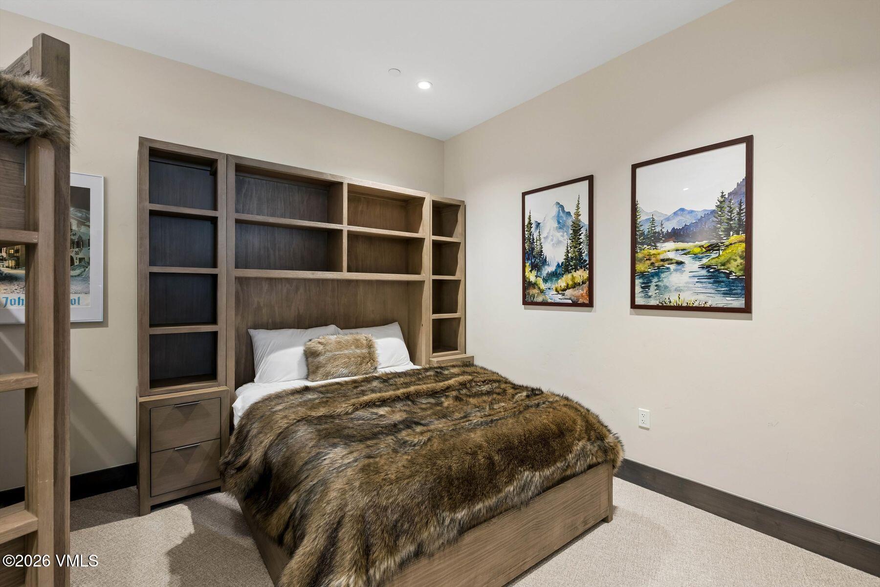 42 Riverfront Lane, Unit 508 Avon, CO 81620 - Photo 26 of 57 a bedroom with a large bed and a window