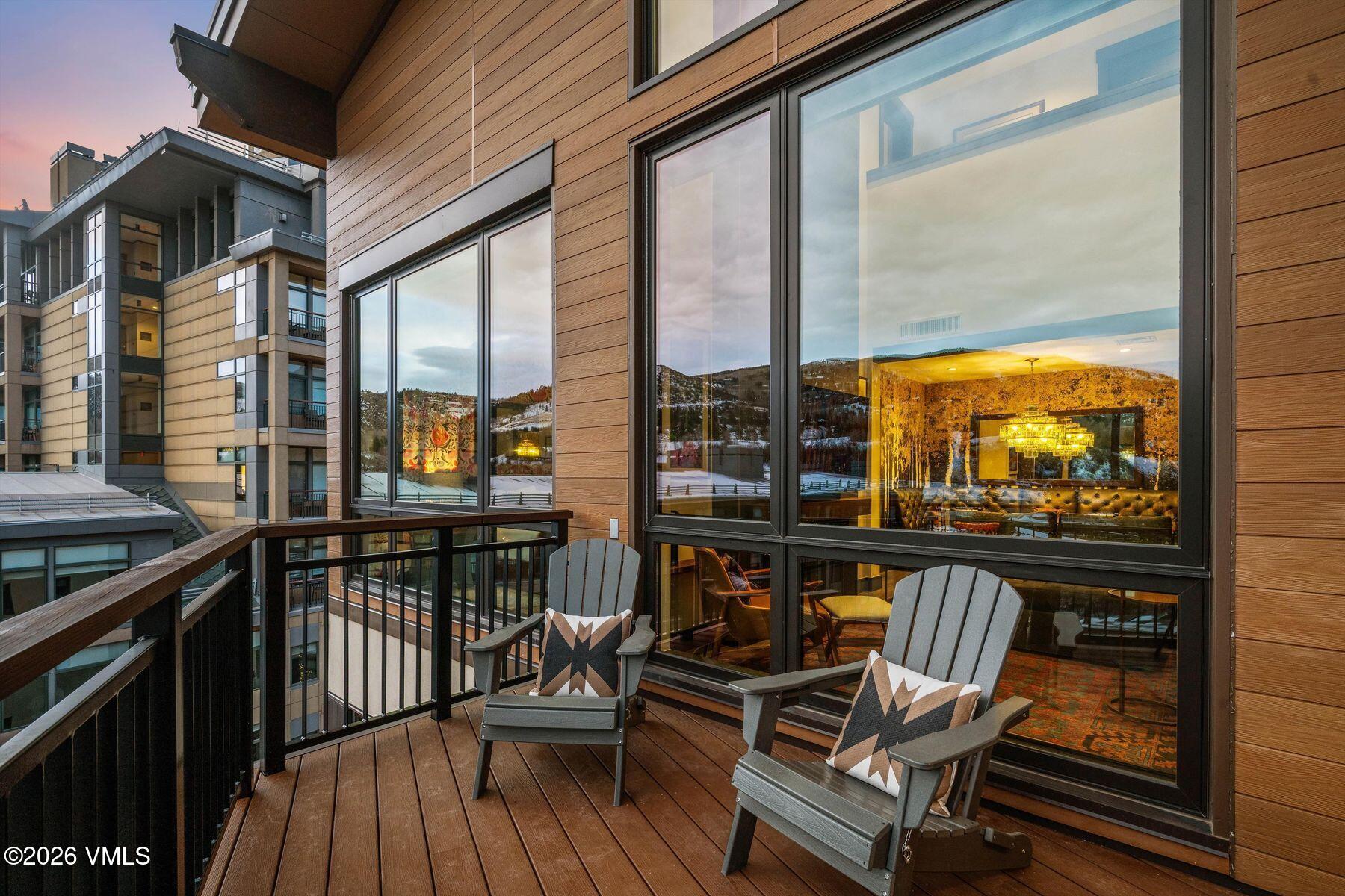 42 Riverfront Lane, Unit 508 Avon, CO 81620 - Photo 33 of 57 a view of a balcony with furniture and wooden floor