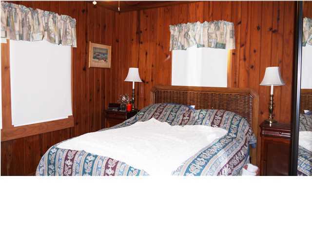 160 Pompano Street Inlet Beach, FL 32461 - Photo 10 of 11 a bedroom with a bed and a window