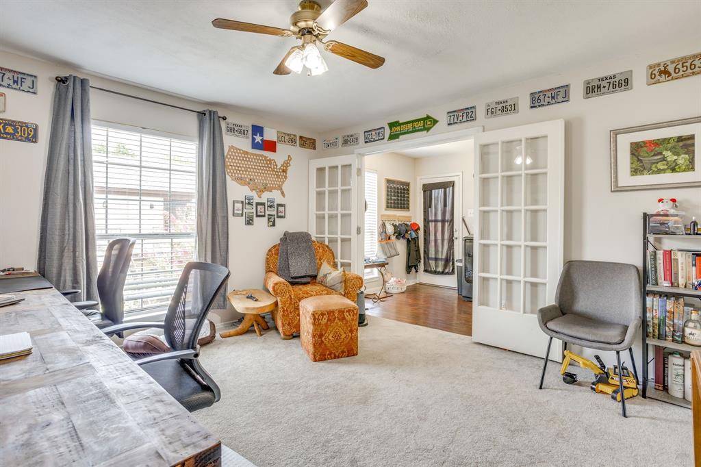 4102 Ridglea Country Club Drive, Unit 1503 Fort Worth, TX 76126 - Photo 8 of 21 Room featuring light-toned carpeting, a window with horizontal blinds, and a ceiling fan with integrated lighting